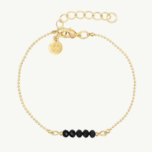 Zwart/goud kleurige facet kralenarmband