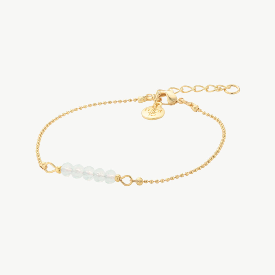Wit-opaal kleurige facet kralenarmband goud