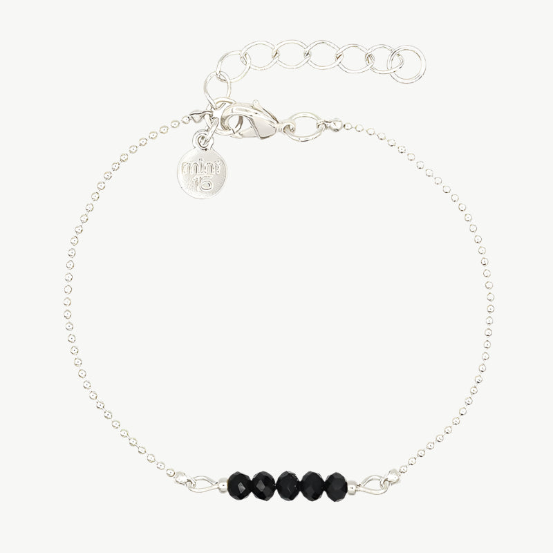 Zwart/zilver kleurige facet kralenarmband
