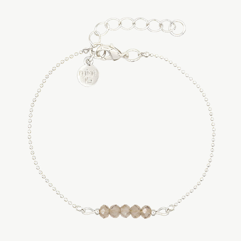 Champagne/zilver kleurige facet kralenarmband